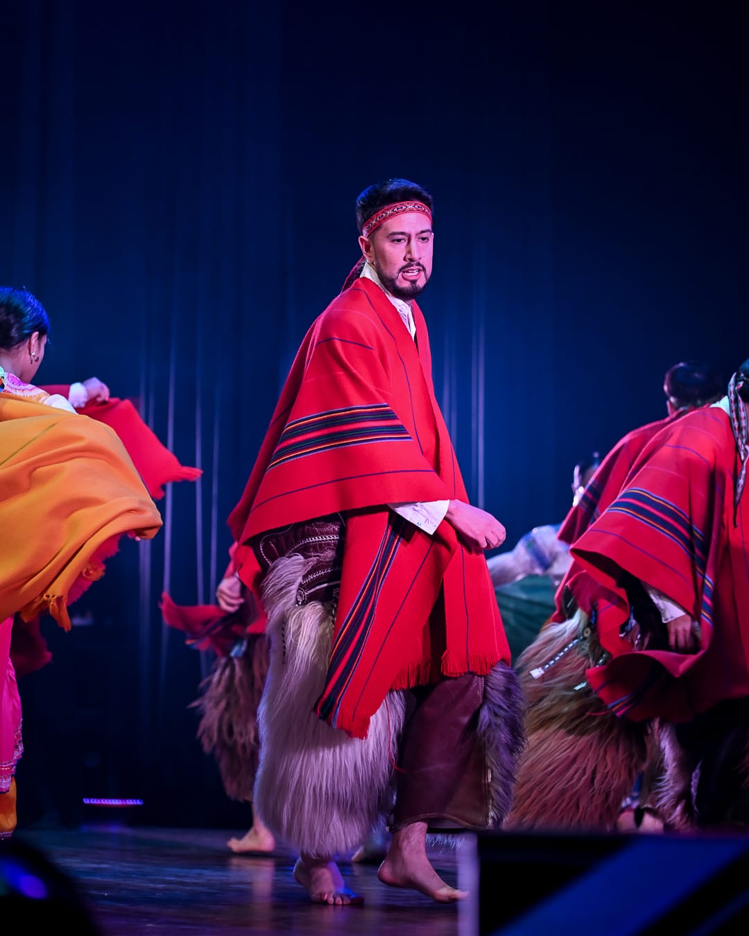 Cultural performance showcasing traditional Ecuadorian dress and heritage